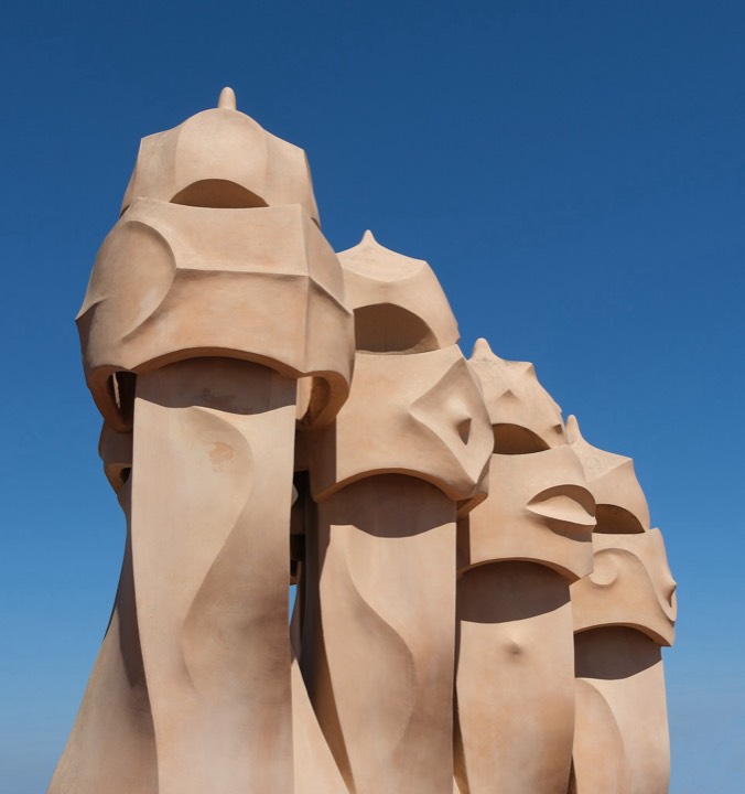 Undulating rooftop of La Pedrera with trencadís chimneys