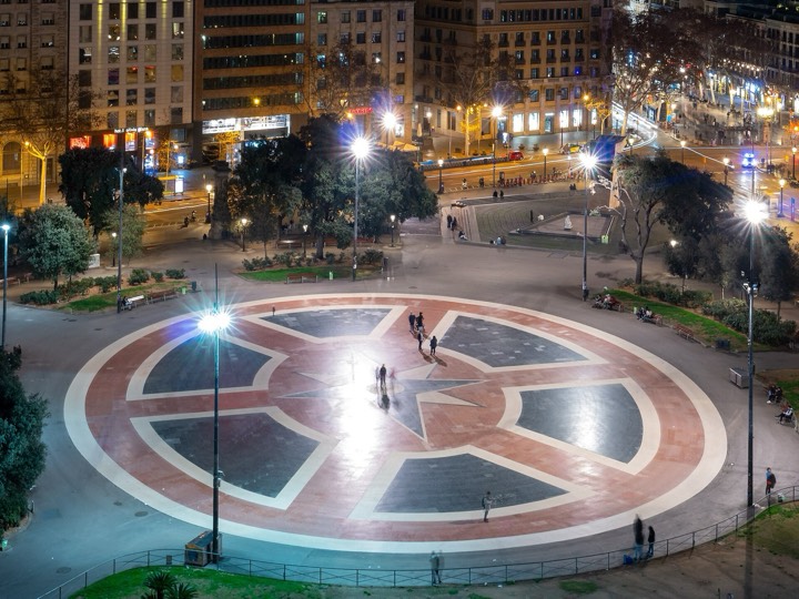 Plaça de Catalunya in Barcelona with its fountains, flower beds and the city-centre buildings around it, the usual meeting point for tours